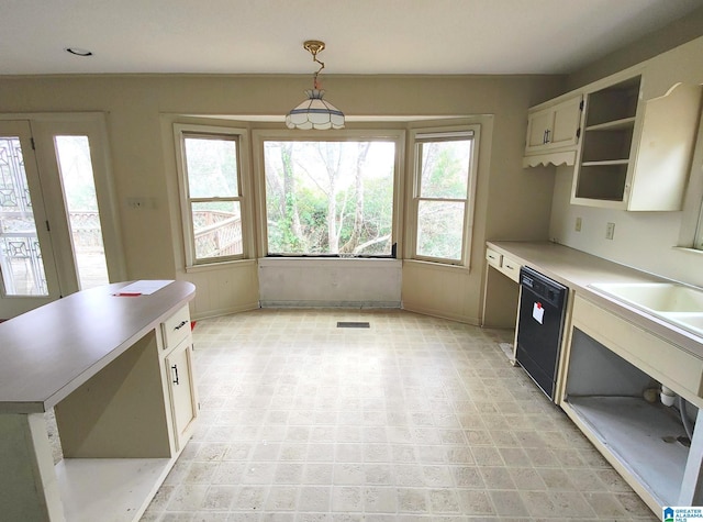 kitchen with visible vents, dishwasher, decorative light fixtures, light countertops, and open shelves