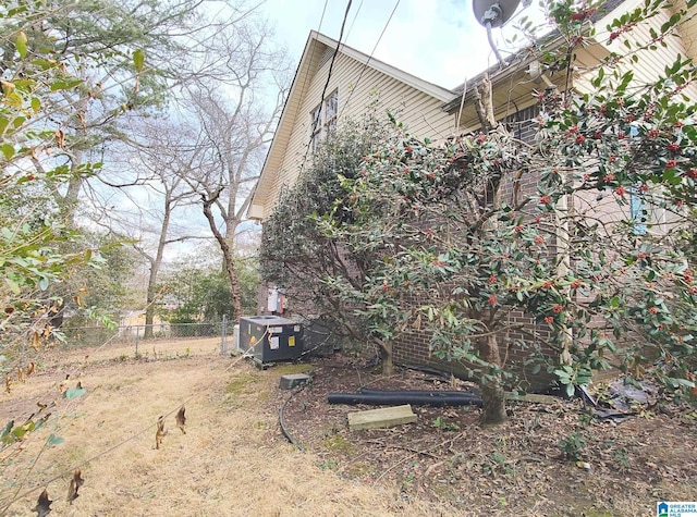 view of side of property with fence