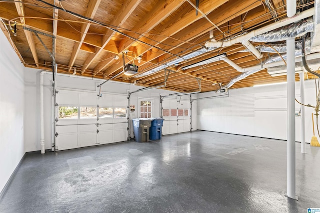 garage featuring baseboards and a garage door opener