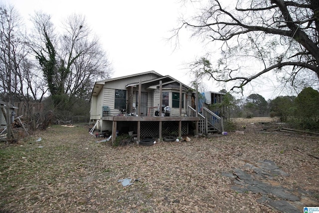 back of house with a wooden deck