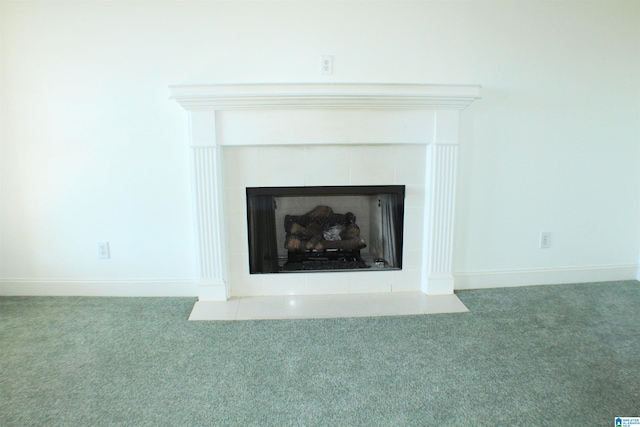 room details featuring a fireplace, baseboards, and carpet flooring