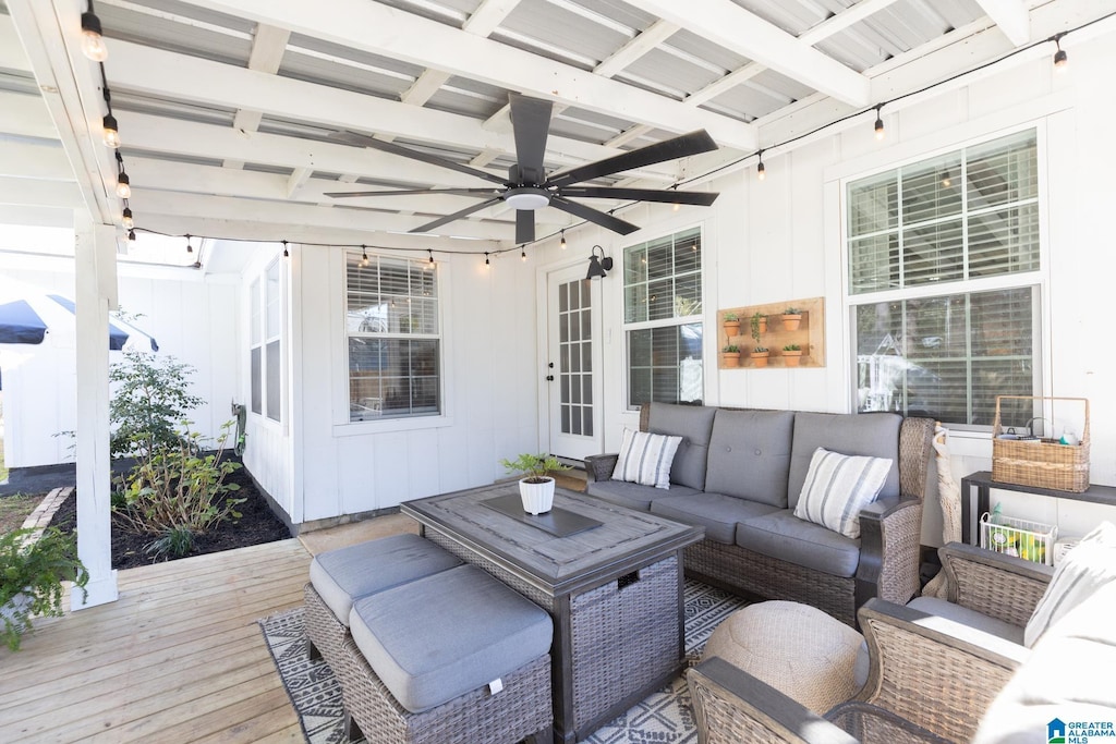 deck with ceiling fan and an outdoor hangout area