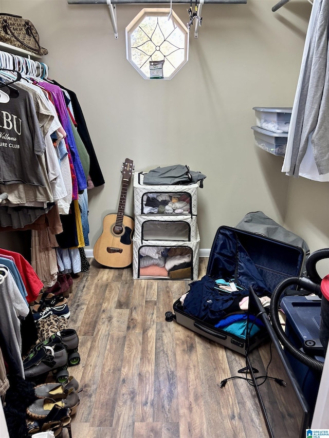 spacious closet featuring wood finished floors