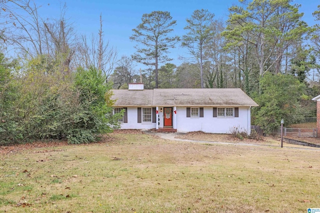 ranch-style house with fence and a front yard