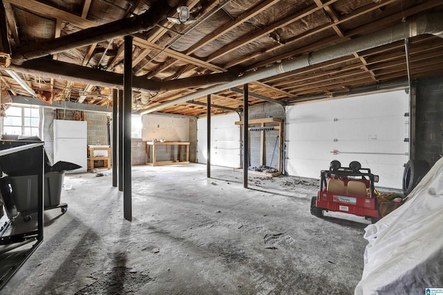 garage with freestanding refrigerator