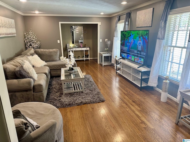 living area featuring ornamental molding, recessed lighting, dark wood finished floors, and baseboards