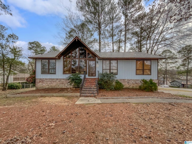 view of front of house with brick siding