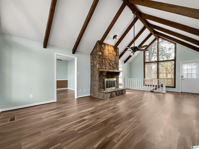 unfurnished living room with a fireplace, wood finished floors, and visible vents