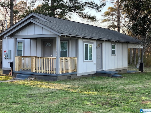 view of front facade with covered porch, a shingled roof, crawl space, and board and batten siding