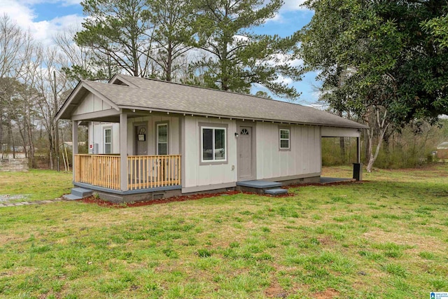 view of front of property with roof with shingles, a porch, board and batten siding, crawl space, and a front lawn