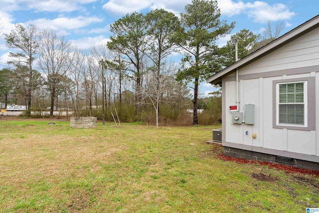 view of yard featuring central air condition unit