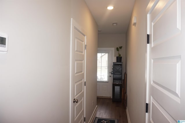 hall with recessed lighting, dark wood-style flooring, and baseboards