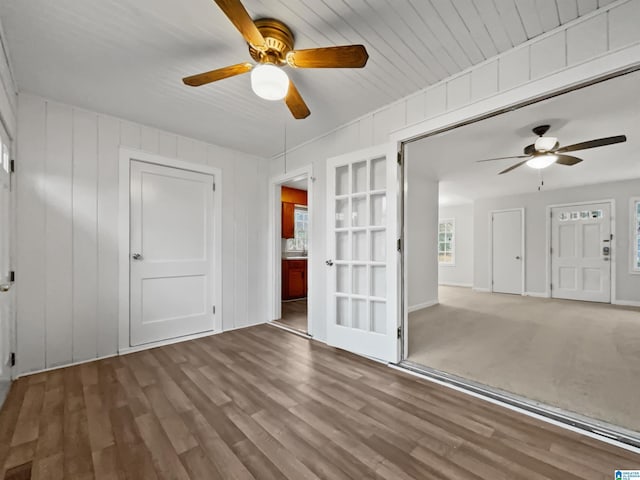 spare room with ceiling fan and wood finished floors