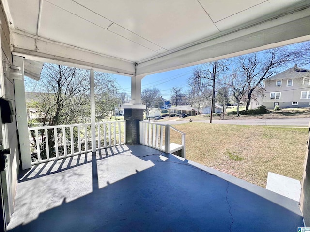 view of patio / terrace featuring covered porch and a residential view