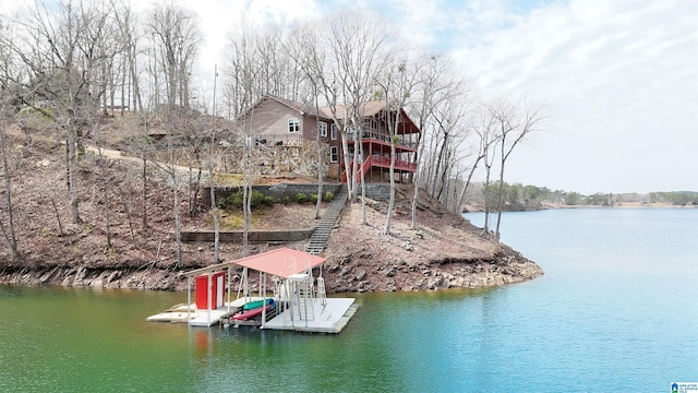 view of dock featuring a water view and boat lift