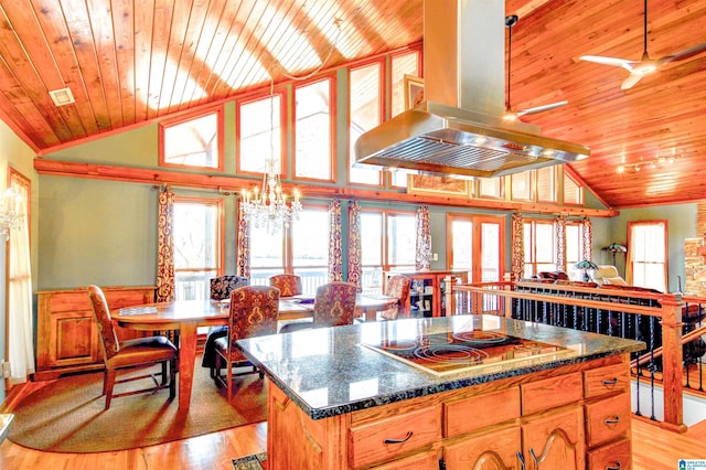 kitchen featuring cooktop, dark countertops, wood ceiling, and island range hood