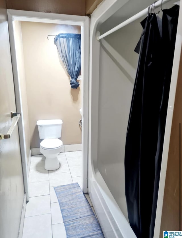 1525 NW Ridge St, Cullman, AL 35055 - full bathroom with toilet and tile patterned flooring