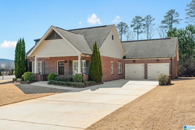 view of front facade with concrete driveway, brick siding, roof with shingles, and an attached garage