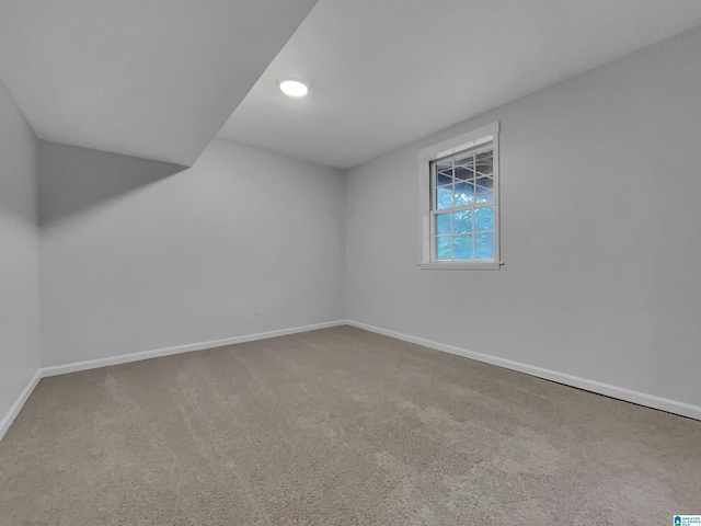 interior space with carpet flooring and baseboards