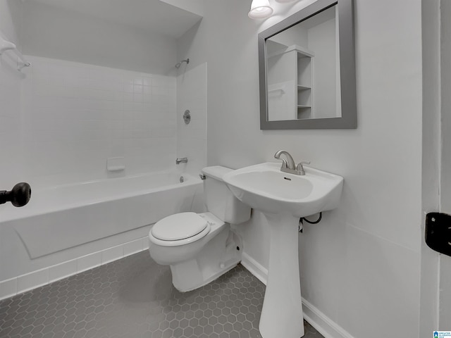 full bathroom with tile patterned flooring, tub / shower combination, and toilet