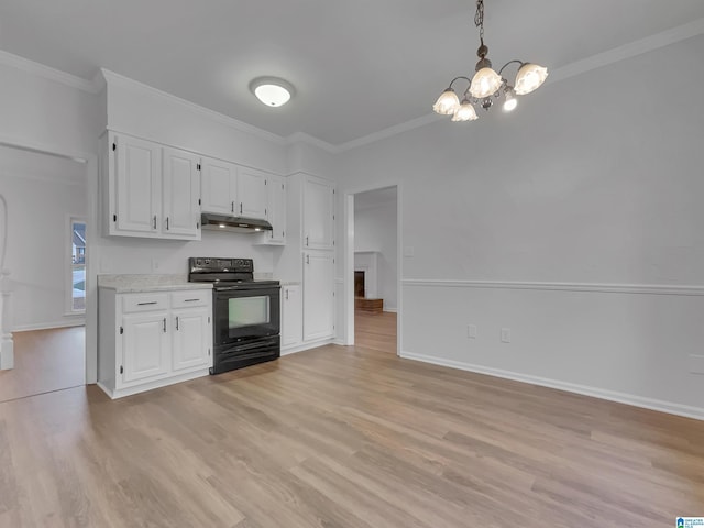 kitchen featuring under cabinet range hood, ornamental molding, light wood-style floors, and black range with electric stovetop