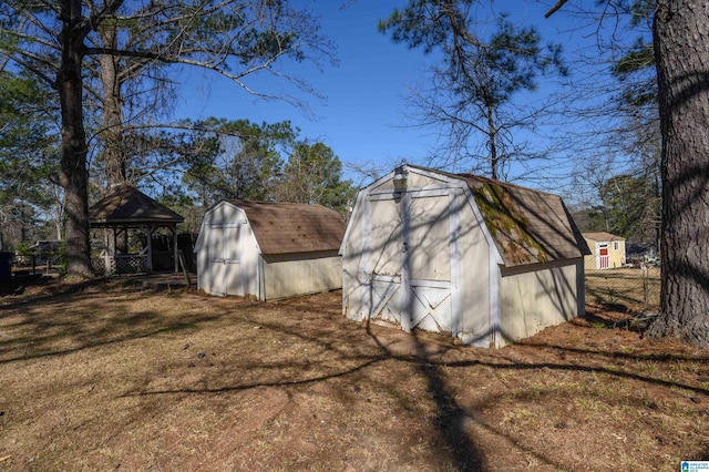 view of shed featuring a gazebo and fence