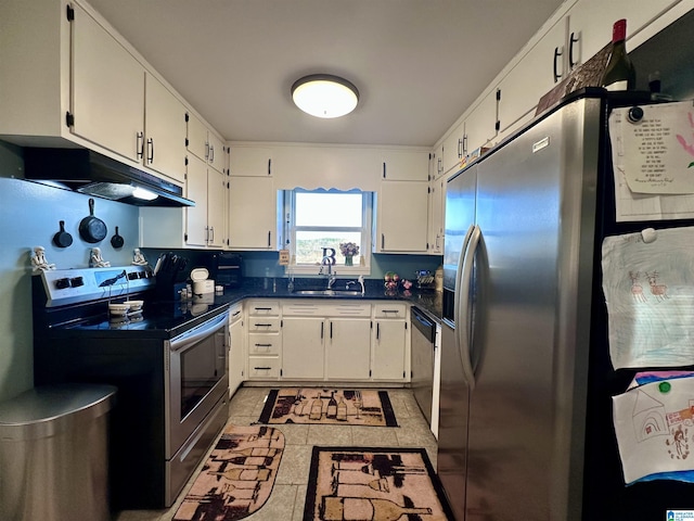 kitchen with white cabinets, under cabinet range hood, a sink, dark countertops, and stainless steel appliances
