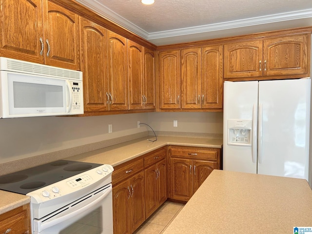 kitchen featuring light countertops, white appliances, light tile patterned flooring, and brown cabinets