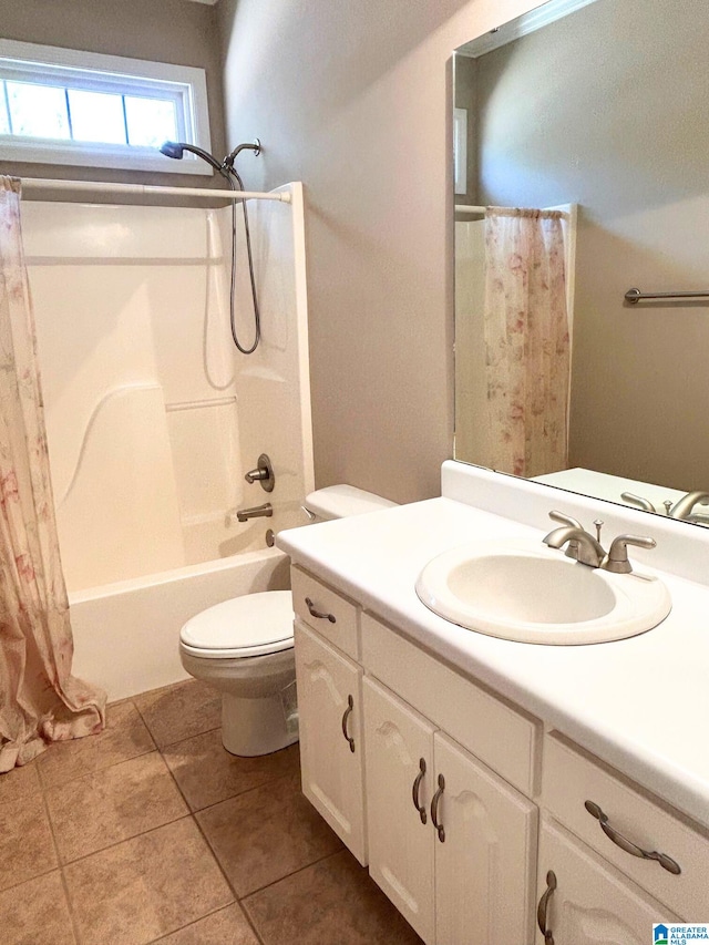 bathroom featuring shower / bath combo, vanity, toilet, and tile patterned floors