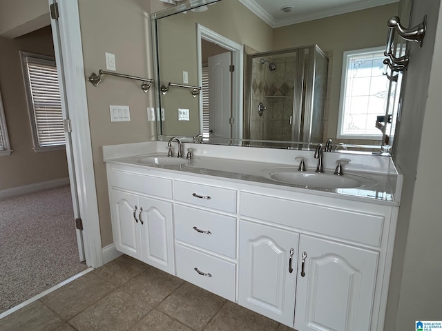 full bathroom featuring crown molding, a stall shower, a sink, and double vanity