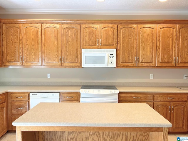 kitchen featuring brown cabinets, white appliances, light countertops, and crown molding