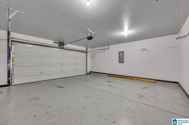 garage featuring baseboards, electric panel, and a garage door opener