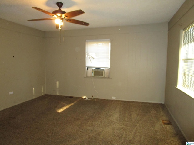 empty room with ceiling fan, cooling unit, and carpet flooring