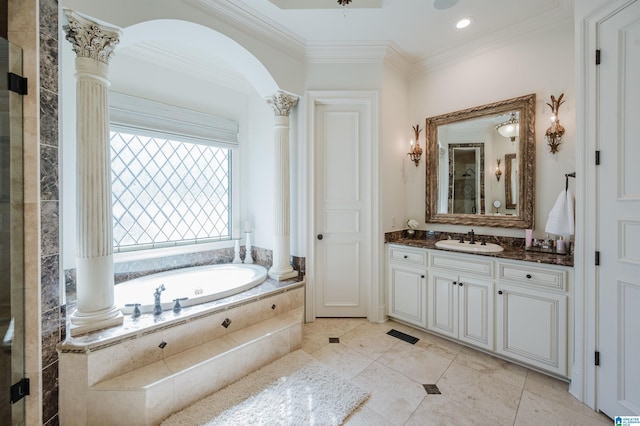 full bathroom with decorative columns, ornamental molding, tile patterned floors, vanity, and a bath