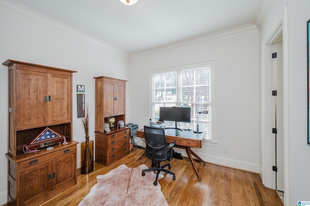 home office featuring light wood-type flooring, baseboards, and crown molding