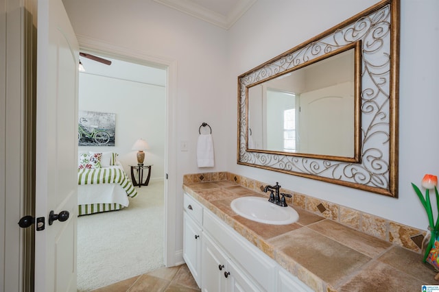 bathroom featuring crown molding, vanity, and tile patterned floors