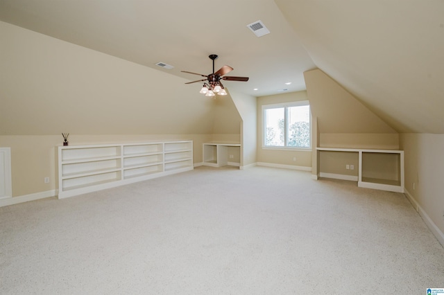 bonus room with vaulted ceiling, a ceiling fan, visible vents, and baseboards