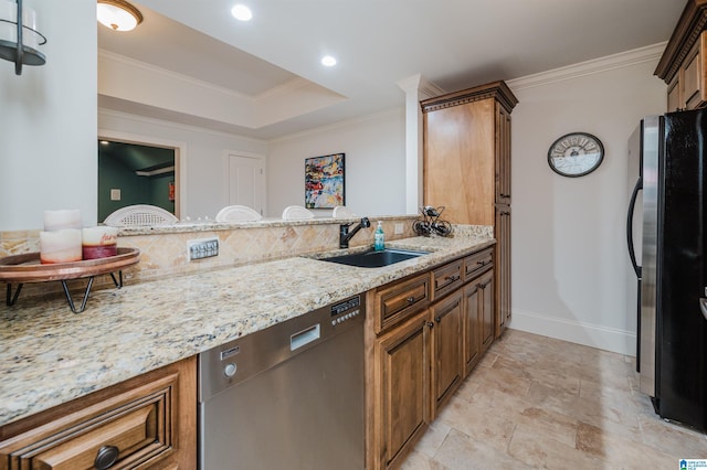 kitchen with ornamental molding, freestanding refrigerator, dishwasher, and a sink