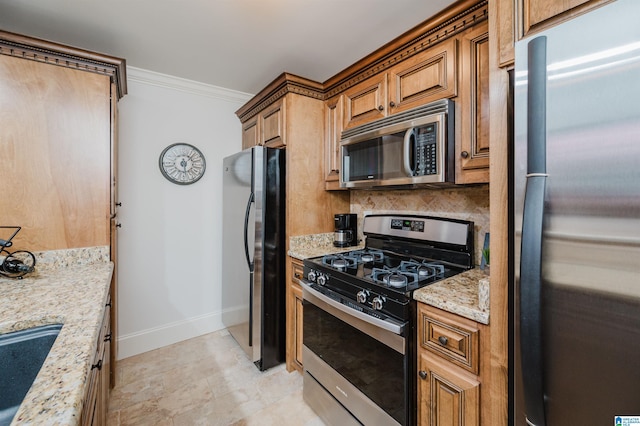 kitchen with decorative backsplash, brown cabinets, light stone countertops, stainless steel appliances, and crown molding