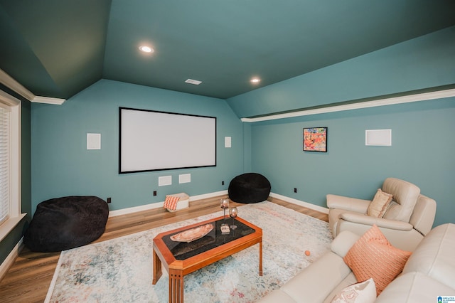 cinema with lofted ceiling, baseboards, wood finished floors, and recessed lighting