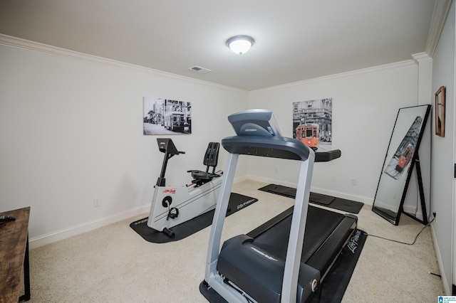 workout area featuring ornamental molding, visible vents, and baseboards