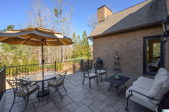 view of patio with an outdoor hangout area and outdoor dining area