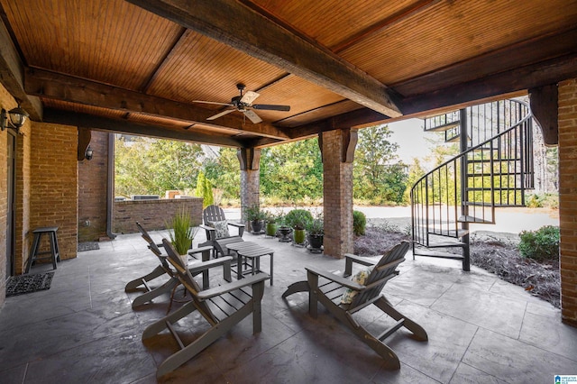 view of patio with stairs and a ceiling fan