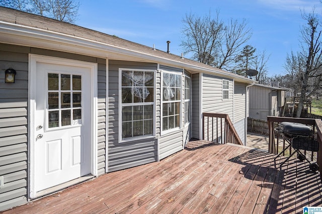 wooden terrace featuring grilling area