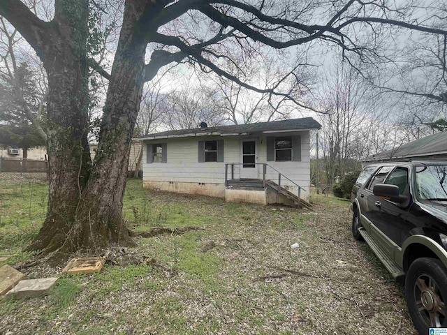 view of front of house with crawl space