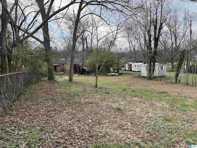 1812 Crescent Ave, Bessemer, AL 35020 - view of yard with fence, an outdoor structure, and a storage shed