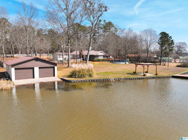 dock area with a water view and a lawn