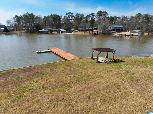 dock area featuring a water view and a yard