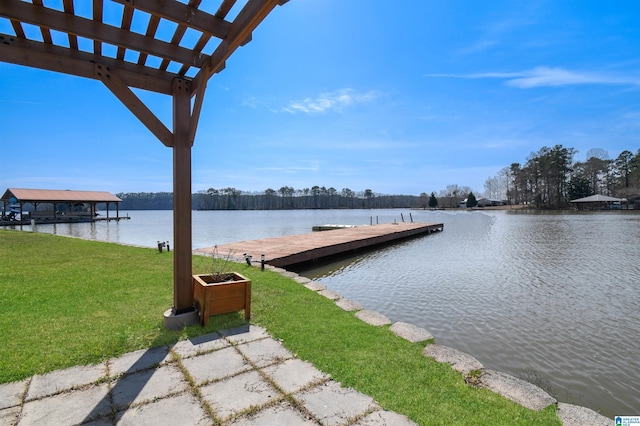 view of dock featuring a water view and a lawn