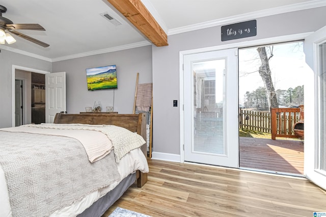 bedroom featuring ornamental molding, multiple windows, light wood-type flooring, and access to exterior